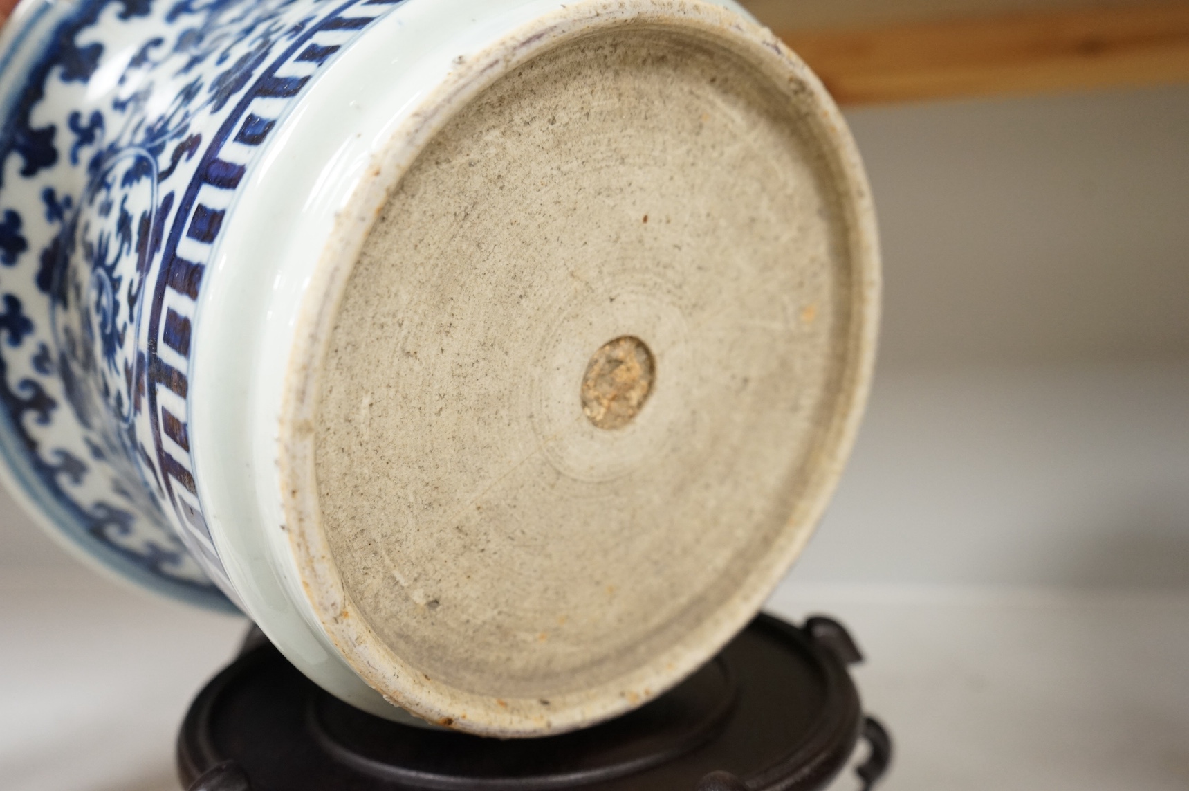 A Chinese blue and white bowl, on stand, 23cm high. Condition - fair